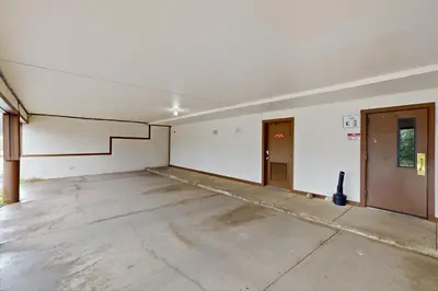 an empty room with a staircase in a building at Buffalo Ridge C302 in Silverthorne