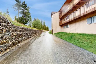 an empty road next to a building at Buffalo Ridge C302 in Silverthorne