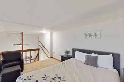 a bedroom with a bed and a chair at Buffalo Ridge C302 in Silverthorne