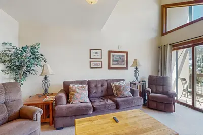 a living room with a couch and a table at Oro Grande 414 in Keystone