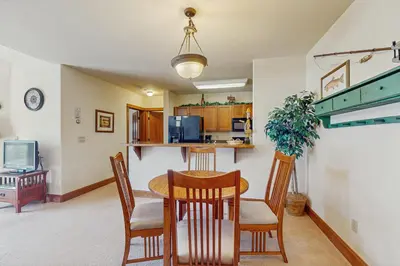 a kitchen and dining room with a table and chairs at Oro Grande 414 in Keystone