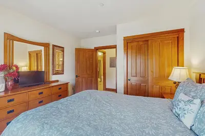 a bedroom with a bed and a television in it at Oro Grande 414 in Keystone