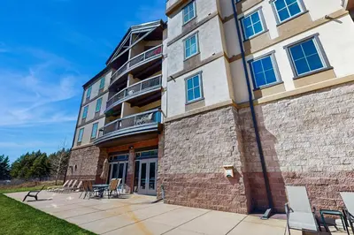 a building with chairs and tables in front of it at Oro Grande 414 in Keystone