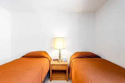 two beds sitting next to each other in a room at Buffalo Ridge C102 in Silverthorne