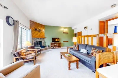 a living room with couches and a fireplace at Buffalo Ridge C102 in Silverthorne