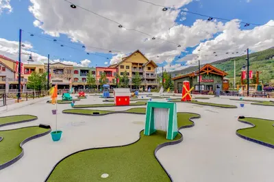 an empty playground in a town with buildings at Buffalo Lodge 8372 in Keystone