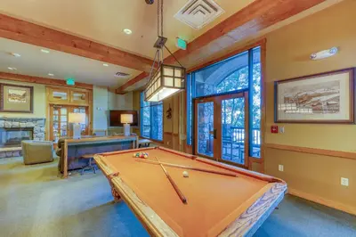 a game room with a pool table in a house at Buffalo Lodge 8372 in Keystone
