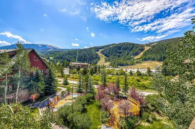 an aerial view of a village with mountains in the background at Tenderfoot Lodge 2664 in Keystone