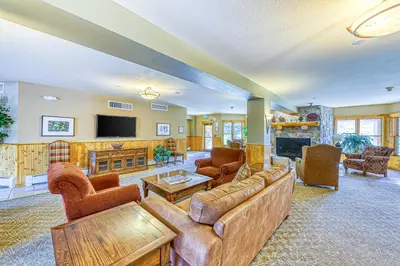 a large living room with couches and a tv at Tenderfoot Lodge 2664 in Keystone
