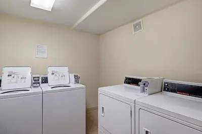 a laundry room with two washers and two dryers at Oro Grande 216 in Keystone