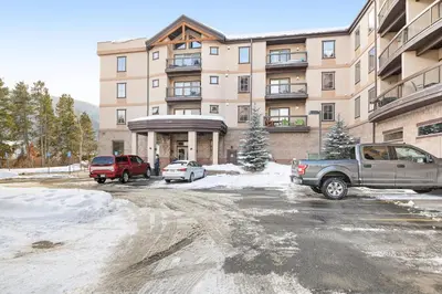a parking lot in front of a large building at Oro Grande 216 in Keystone