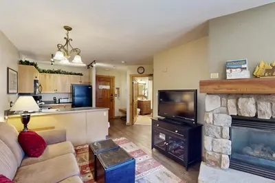 a living room with a couch and a fireplace at Keystone Condo 8380 in Keystone