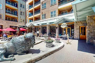 a statue of a bull on a street in a city at Keystone Condo 8380 in Keystone