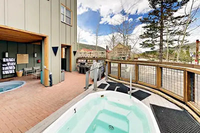 a jacuzzi tub on the balcony of a house at Keystone Condo 8380 in Keystone