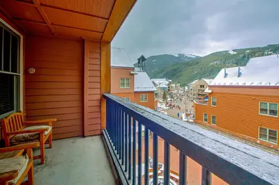 a balcony with a view of a town and mountains at Keystone Condo 8380 in Keystone
