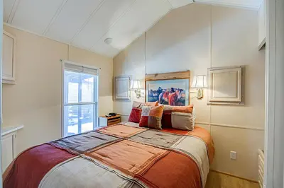 a bedroom with a large bed and a window at #84 Tiger Run in Breckenridge