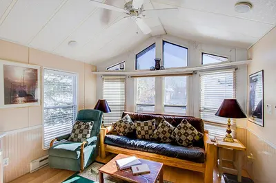 a living room with a couch and a chair at #84 Tiger Run in Breckenridge