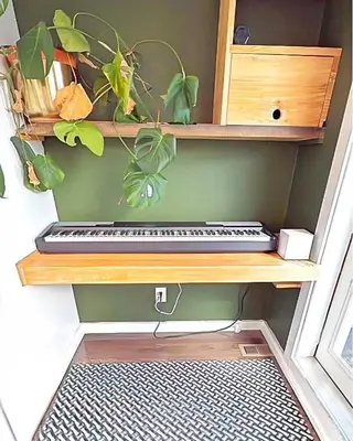 a keyboard on a wooden shelf with plants on it at The Sage Sanctuary in Denver