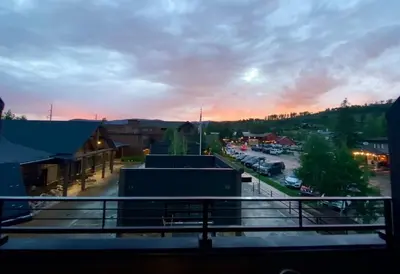 a view from a balcony of a parking lot at Stylish Grand Lake Retreat - King Bed - Walk to Lake in Grand Lake