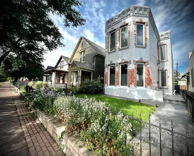 a house with a garden in front of it at UPTOWN CASTLE - CITY VIEWS - THEATER & CONVENTION DISTRICT! in Denver