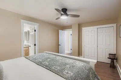 a bedroom with a bed and a ceiling fan at Bright and Cozy Ranch Style House Centennial in Centennial