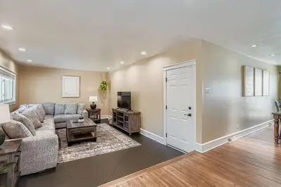 a living room with a couch and a table at Bright and Cozy Ranch Style House Centennial in Centennial