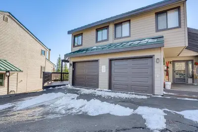a house with two garage doors in a driveway at Multi-Level Haven 3 Mi to Lake Dillon in Silverthorne