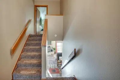 a staircase in a home with a stair case at Multi-Level Haven 3 Mi to Lake Dillon in Silverthorne
