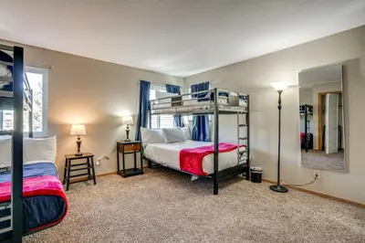 a bedroom with two bunk beds and a mirror at Multi-Level Haven 3 Mi to Lake Dillon in Silverthorne