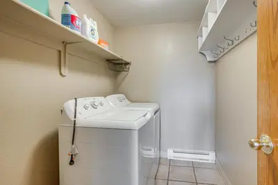 a small laundry room with a washer and dryer at Multi-Level Haven 3 Mi to Lake Dillon in Silverthorne