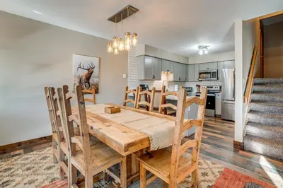 a dining room and kitchen with a table and chairs at Multi-Level Haven 3 Mi to Lake Dillon in Silverthorne