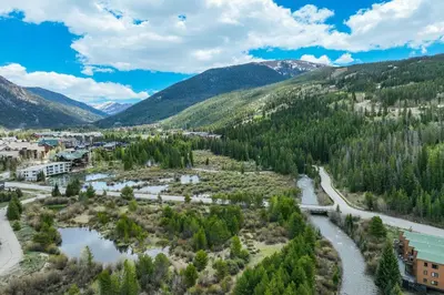 an aerial view of a town with a river and mountains at #5075 Keystone in Keystone