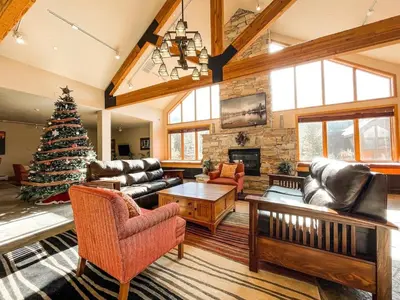 a living room with a christmas tree in it at #5075 Keystone in Keystone