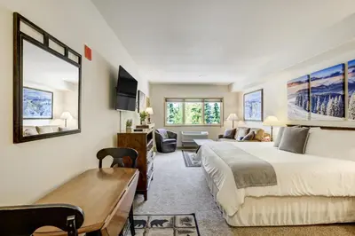 a bedroom with a large bed and a living room at #5072 Keystone in Keystone