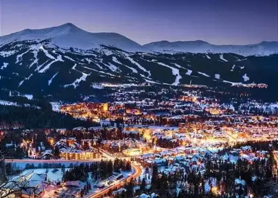 a view of a city at night with mountains at #5072 Keystone in Keystone