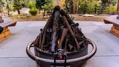 a bucket full of fire logs sitting on a patio at Grand Lodge in Estes Park