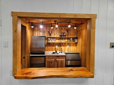 a kitchen with wooden walls and a wooden counter top at Grand Lodge in Estes Park