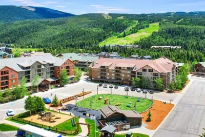 an aerial view of a resort with a park at Kindred Resort Luxury Ski In, Ski Out 1 Bedroom Residence At The River Run Gondola in Dillon