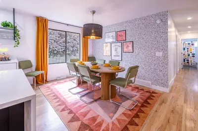 a dining room with a table and chairs at Movie Theater and Mini Golf with 2 King Beds in Westminster