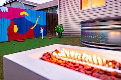 a fire pit in a yard next to a house at Movie Theater and Mini Golf with 2 King Beds in Westminster