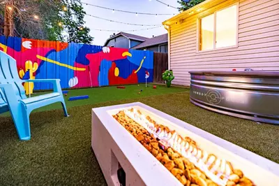 a container of peanuts in a yard next to a fence at Movie Theater and Mini Golf with 2 King Beds in Westminster