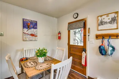 a dining room with a table and chairs at The Mountain Chalet - Free Ski Shuttle to Lifts! in Winter Park