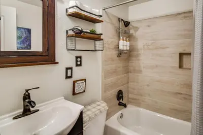 a bathroom with a white tub and a sink at The Mountain Chalet - Free Ski Shuttle to Lifts! in Winter Park