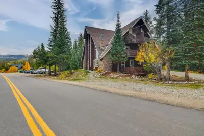a house sitting on the side of a road at The Mountain Chalet - Free Ski Shuttle to Lifts! in Winter Park