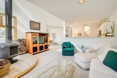 a living room with a couch and a fireplace at Mtn-View Deck, Workspace! Walkable Frisco Condo in Frisco