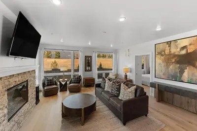 a living room with a couch and a fireplace at Brightwood 105 in Keystone