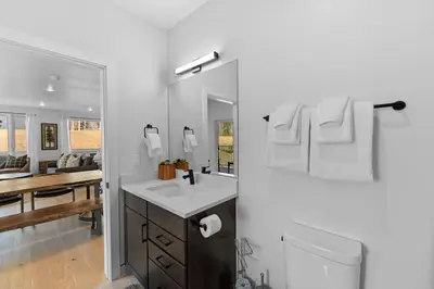 a bathroom with a sink and a mirror at Brightwood 105 in Keystone