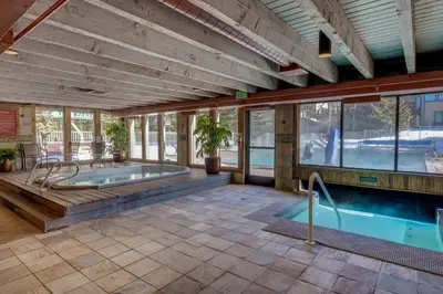 a swimming pool in a building with a swimming pool at Brightwood 105 in Keystone