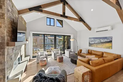 a living room with a couch and a fireplace at Alcove 39 in Keystone