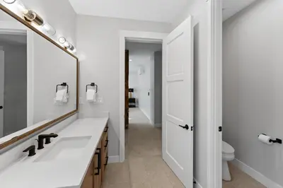 a bathroom with a sink and a mirror at Alcove 39 in Keystone